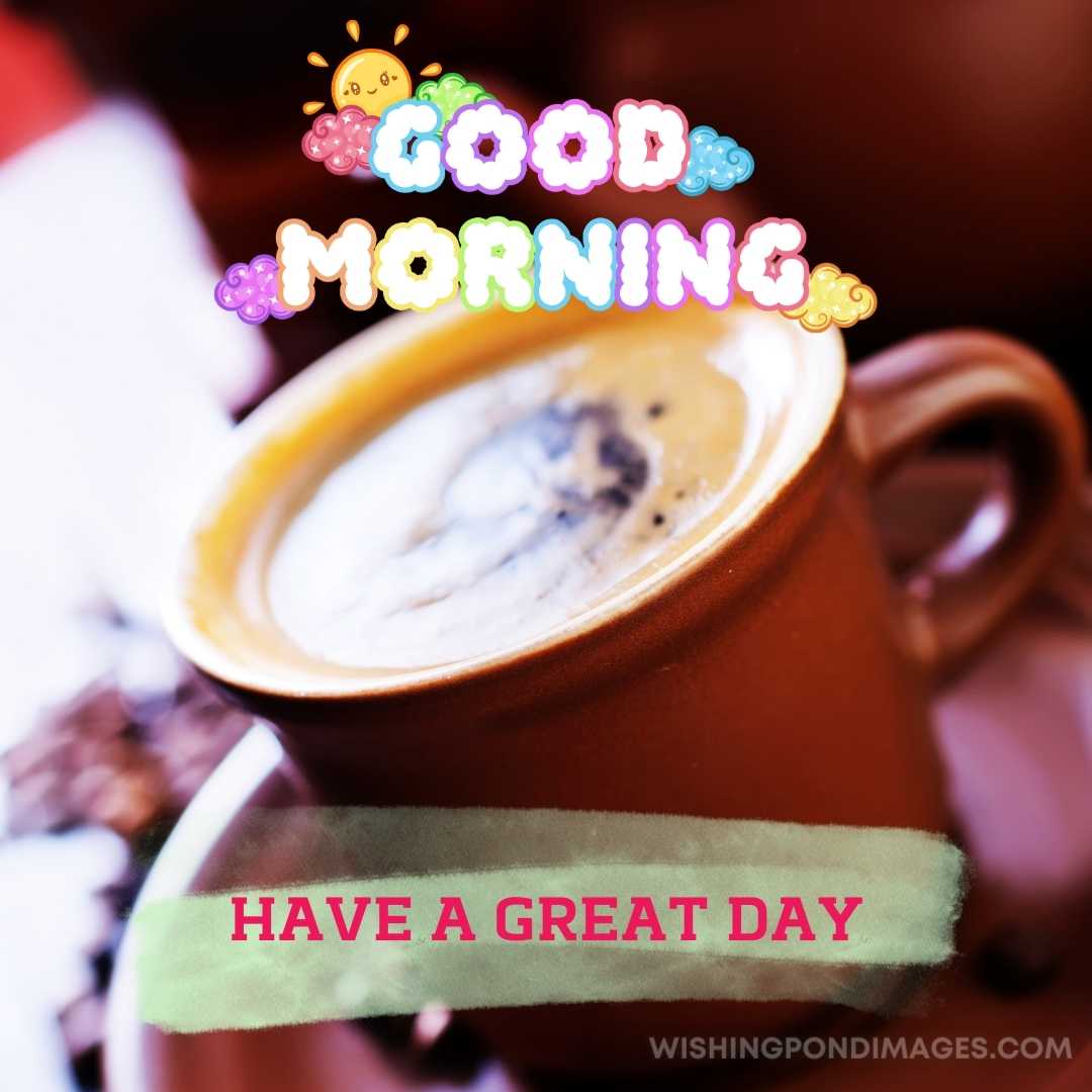 A cup of coffee image in red colored cup in the plate sitting on the table. Good Morning Coffee Imag